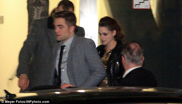 Sneaking out: Rob and Kristen left the premiere as soon as their work was done, both dying to get out of their posh threads 