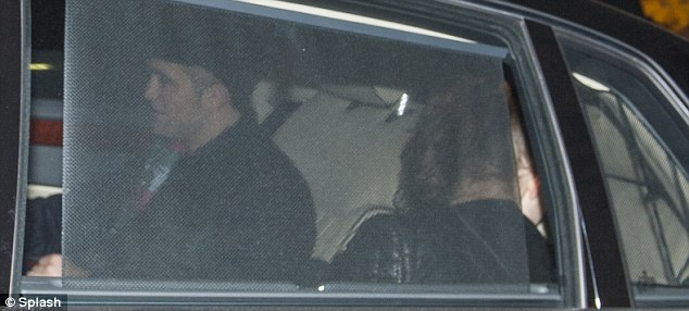 So close: The pair like to avoid posing together apart from on the red carpet but can be seen clearly leaving the alley in the back of the same car 