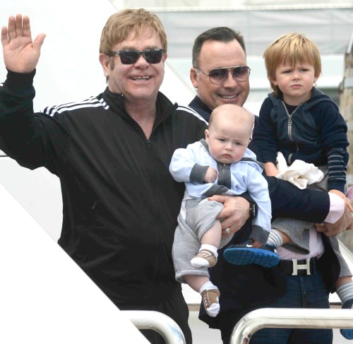 Piano man Elton John and David Furnish arrive in Venice **USA ONLY**