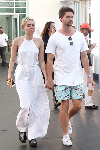 EXCLUSIVE: Miley Cyrus and her boyfriend Patrick Schwarzenegger show plenty of PDA while out and about in South Beach today