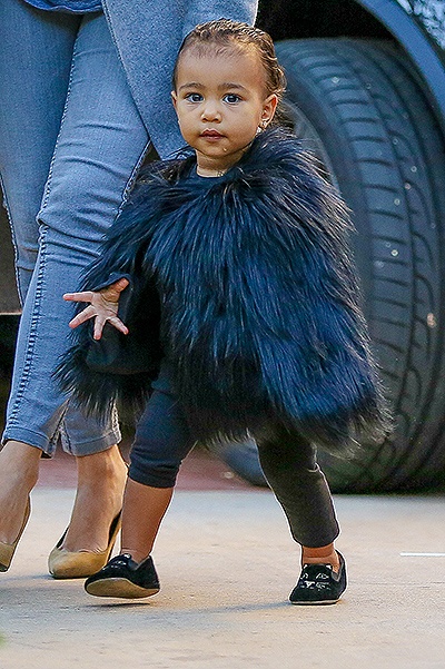 little Nori North West rocks a black fur for a play date