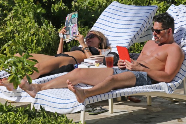 EXCLUSIVE: A bikini clad Sofia Vergara and shirtless Joe Manganiello lounge by the pool in Hawaii.