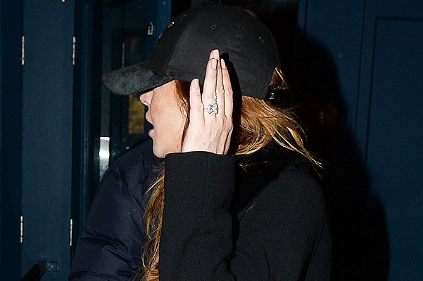 EXCLUSIVE: Lindsay Lohan sports a large ring on her engagement finger as she is spotted leaving Boujis nightclub in London