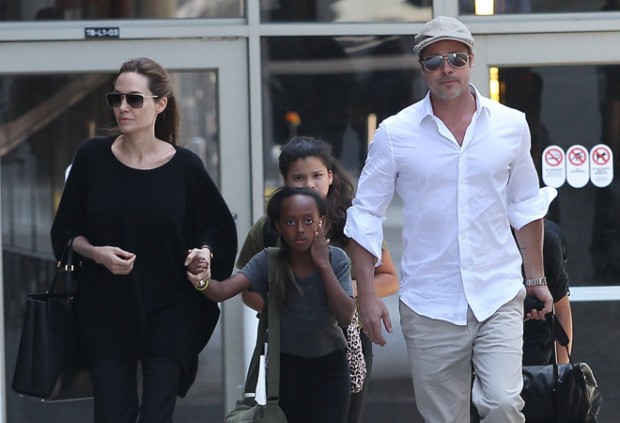 Brad Pitt and Angelina Jolie arrive at LAX with the kids