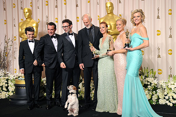 HOLLYWOOD, CA - FEBRUARY 26:  (L-R)  Producer Thomas Langmann, actor Jean Dujardin, director Michel Hazanavicius, actors James Cromwell, Berenice Bejo, Uggie the dog, Penelope Ann Miller, and Missi Pyle  pose in the press room after winning the Best Picture Award at the 84th Annual Academy Awards held at the Hollywood & Highland Center on February 26, 2012 in Hollywood, California.  (Photo by Jason Merritt/Getty Images) 