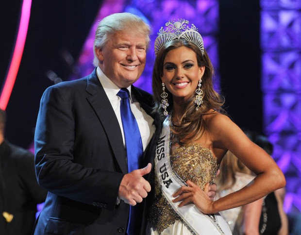 From left, Donald Trump and Miss Connecticut USA Erin Brady pose onstage after Brady won the 2013 Miss USA pageant, Sunday, June 16, 2013, in Las Vegas. (AP Photo/Jeff Bottari) 
