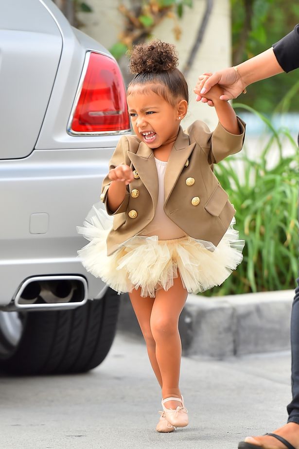 North-West-arrives-at-ballet-wearing-a-brown-coat-and-tutu