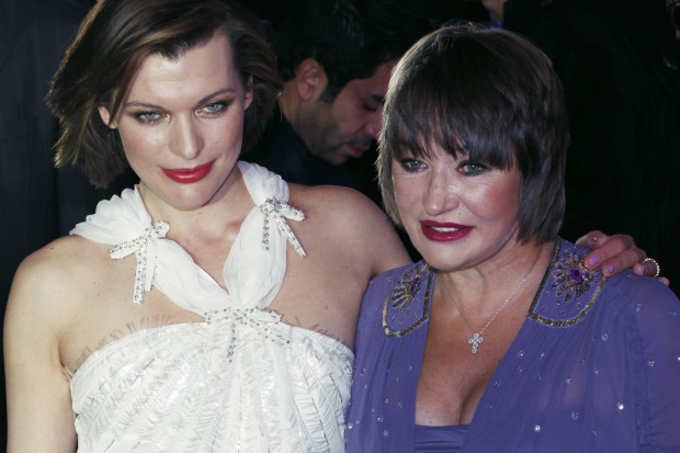 Actress Milla Jovovich and mother Galina Jovovich  pose for photographers before the premiere of Russian movie "Whims" in Moscow, Russia, on Monday, Feb.14, 2011. (AP Photo/Pavel Golovkin) Russia Jovovich 