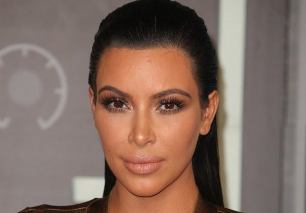 kim-kardashian-drops-lawsuit-after-tabloid-apologizes-for-fake-robbery-claims