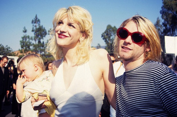 Kurt Cobain of Nirvana (right) with wife Courtney Love and daughter Frances Bean Cobain (Photo by Terry McGinnis/WireImage) 