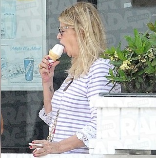 Kirstie Alley enjoys ice cream and cigarettes