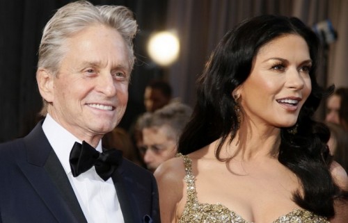 Actor, Oscars presenter Michael Douglas and his wife, actress Catherine Zeta-Jones arrive at the 85th Academy Awards in Hollywood, California