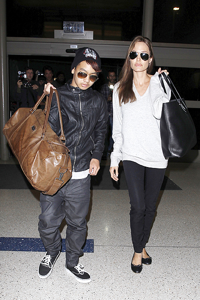 Angelina Jolie and Maddox head out of town on a Valentine's Day flight