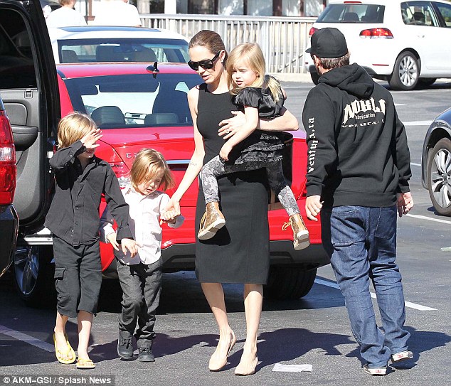 Shop-a-thon: The actress and her brood arrive at the store before the shopping expedition