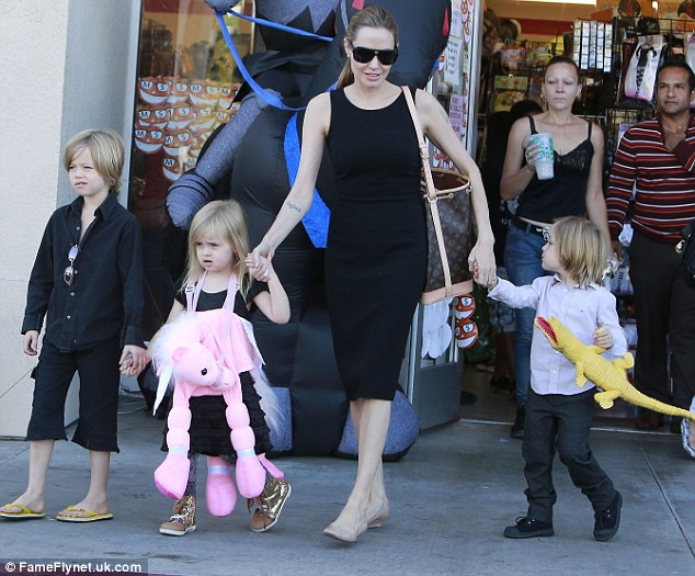 Getting into the Halloween spirit: Angelina Jolie was seen rounding up some of her brood, including Shiloh, and twins Vivienne and Knox, for a trip to Party City in Sherman Oaks to shop for Halloween supplies on Sunday 