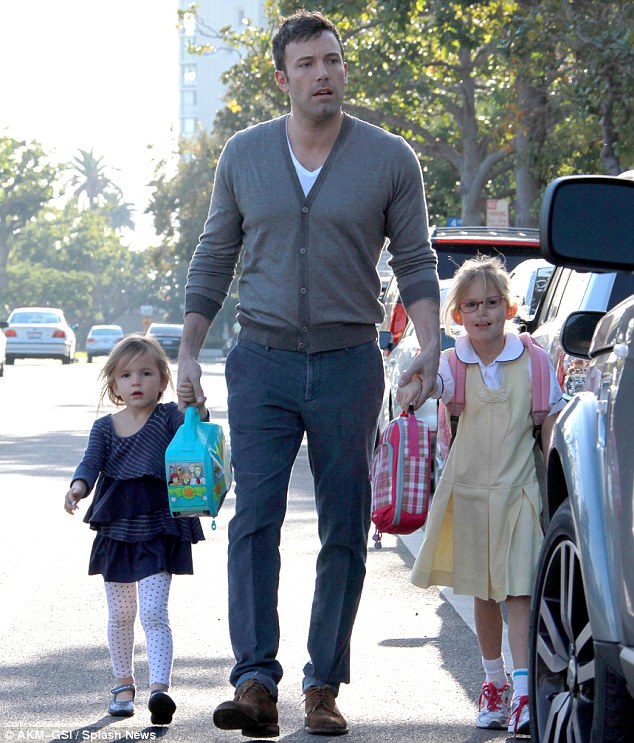 Hands full: Ben Affleck was on daddy duty Wednesday as he and daughter Seraphina picked up Violet at her school in Brentwood