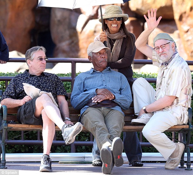 That way inKlined: Gregarious Kevin gave a friendly wave while Robert De Niro and Morgan Freeman sat stony faced on the set of Last Vegas on Thursday