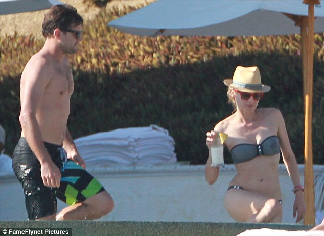 Mexican getaway: Diane Kruger showed off her sensational figure in a dark grey strapless bikini as she continued to enjoy a romantic Mexican break with fiance Joshua Jackson on Saturday