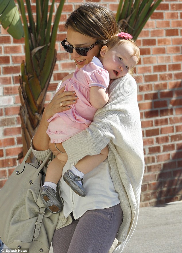 Loving: Jessica Alba shares a cute hug with her baby daughter Haven while out in Santa Monica on Thursday