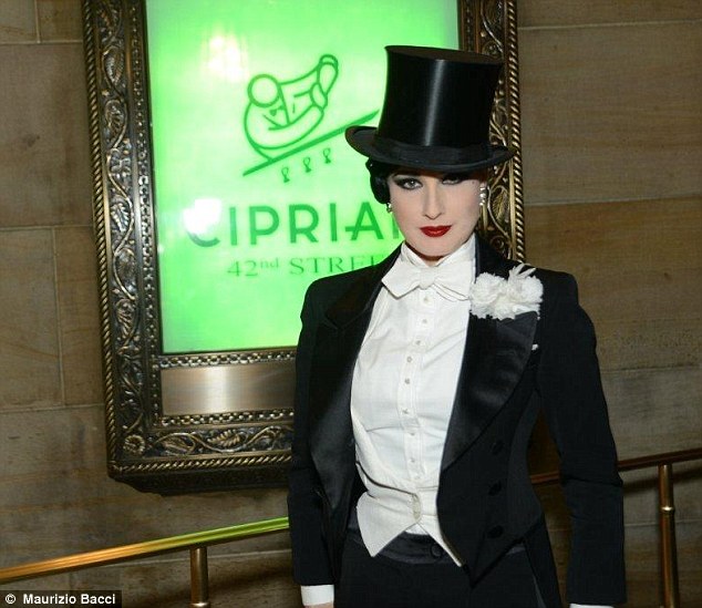 Party time: Burlesque queen Dita Von Teese wore a top hat and tails costume to a Halloween bash on Wednesday night in New York City