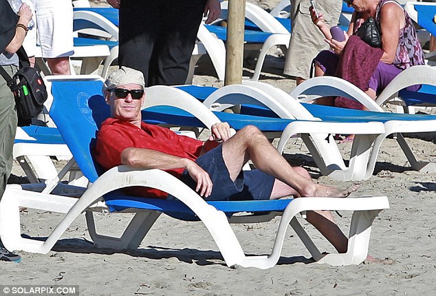 And relax... Brosnan rested on a sun lounger for the rest of his day dressed in the same outfit