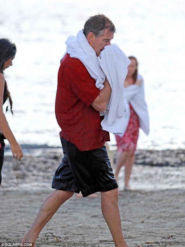 Back on dry land: As soon as the splashing scenes were over he grabbed a towel to dry himself off once the excitement had ended