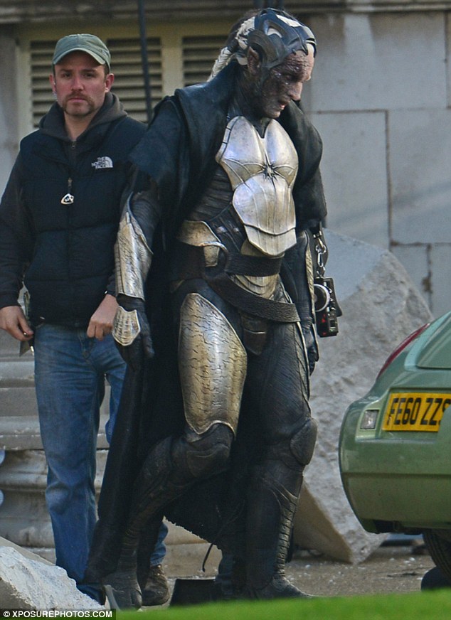 Beefed up for battle: Christopher Eccleston looked much bulkier than usual on set in his battle suit