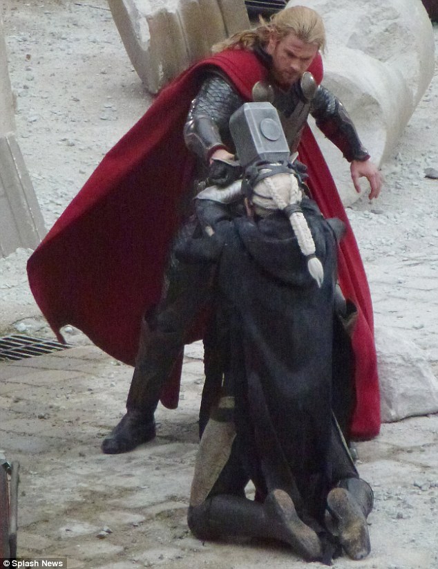 Smackdown: Chris Hemsworth's character Thor gives Malekith a blow to the head with a giant metal hammer