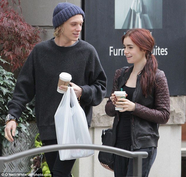 Feeling perky: The couple were smiling as they chatted with coffee in hand