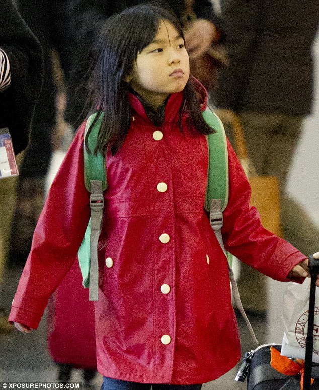 At the reddy: The adorable youngster looked even cuter than usual in her scarlet winter jacket