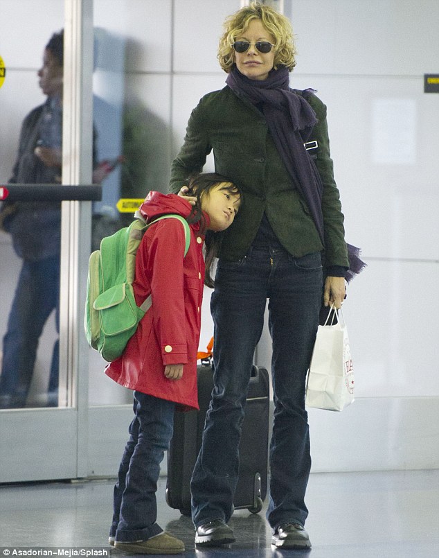 Feeling weary: Meg Ryan's daughter Daisy was looking tired as they got ready to jet out of New York on Friday