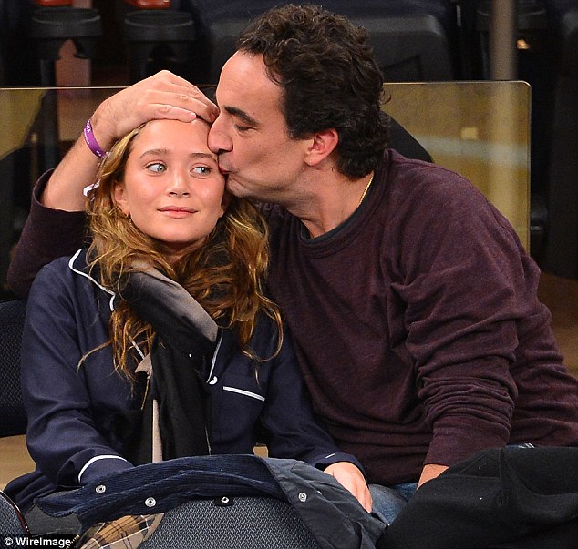 Determined to prove them all wrong: Mary-Kate Olsen and Olivier Sarkozy cuddle up