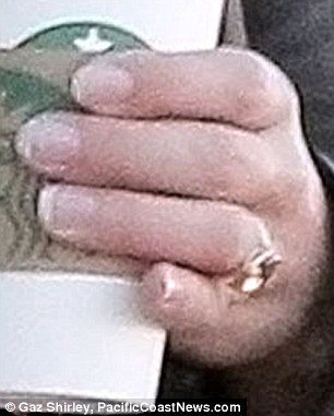 Engaged? The twice-divorced star, who recently turned 39, left Starbucks wearing the flower-shaped ring