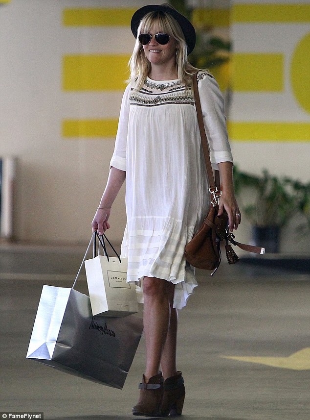 Yummy mummy: Reese Witherspoon looked effortlessly chic in a black fedora and boho-inspired dress as she stepped out in Beverly Hills, California