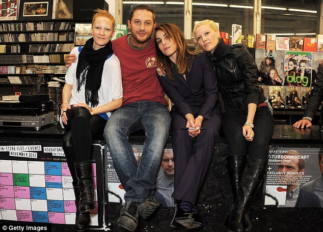 Original blaggers: The magazine founders Sarah and Sally Edwards pose with actors Tom Hardy and Noomi Rapace