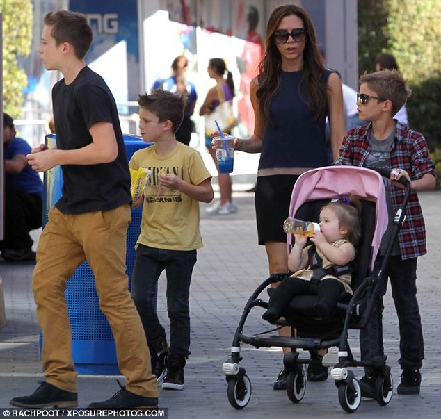 He's shot up: Victoria Beckham was left looking up at 13-year-old son Brooklyn when the brood stepped out in Los Angeles recently